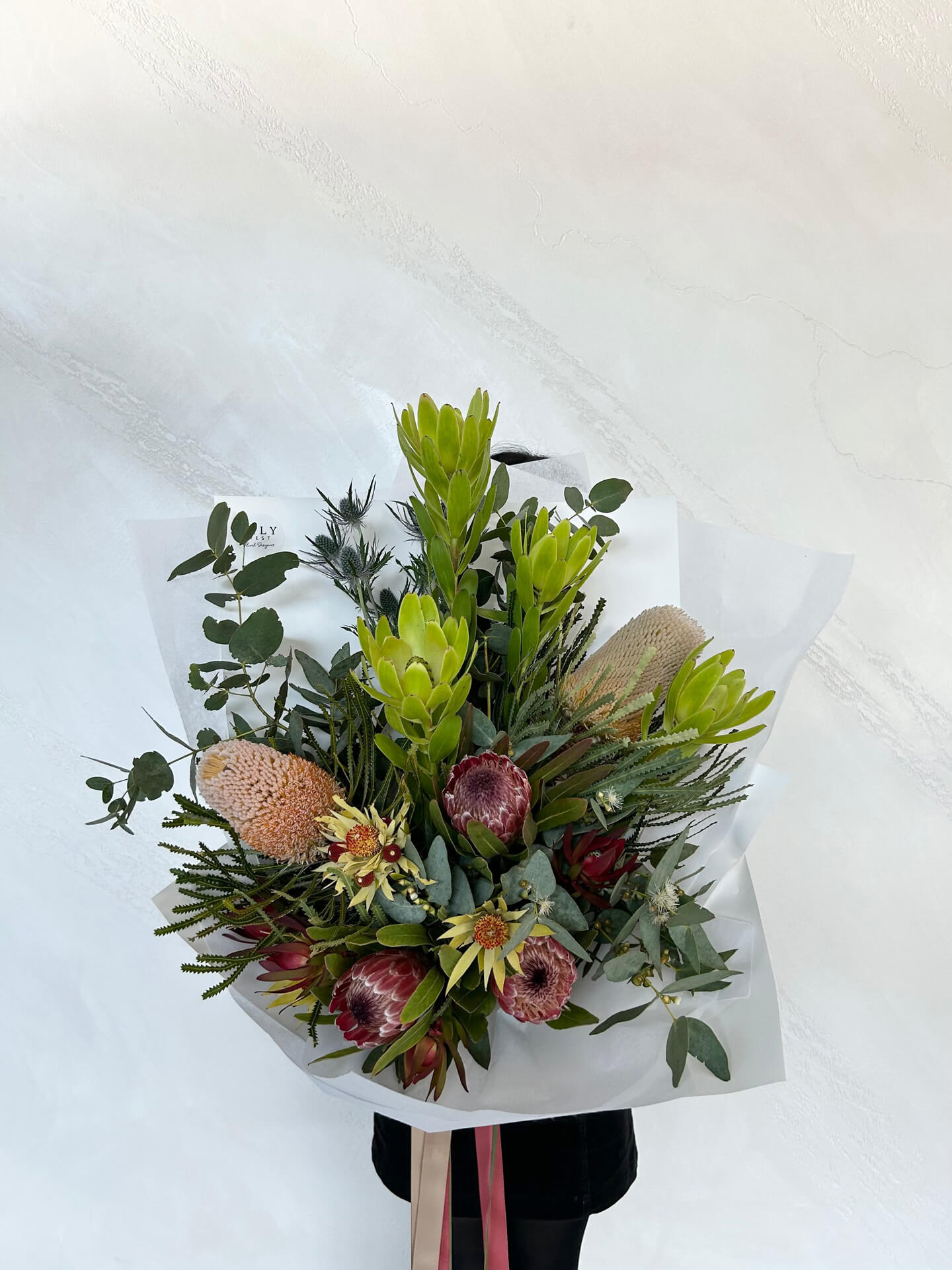 Large bouquet made with seasonal native flowers.